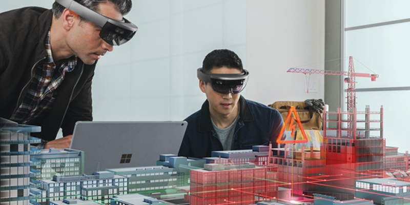 Two people using Microsoft HoloLens